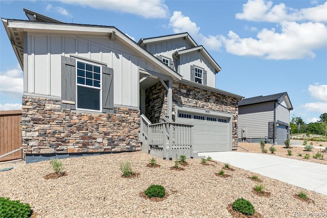 4451 Soapberry Pl, Castle Rock, CO 80108 - craftsman-style home featuring stone siding, board and batten siding, driveway, and an attached garage