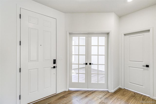 4451 Soapberry Pl, Castle Rock, CO 80108 - doorway with french doors and light wood-style flooring