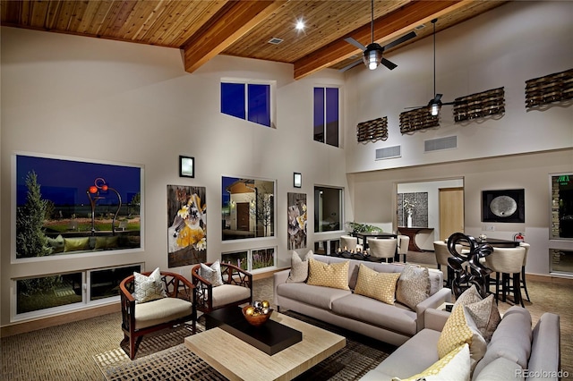 4451 Soapberry Pl, Castle Rock, CO 80108 - carpeted living room with a wooden ceiling with exposed beams, a ceiling fan, and a high ceiling