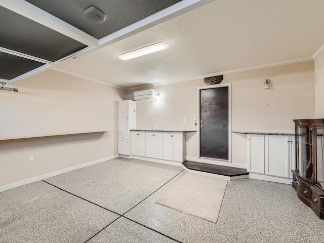 interior space with a wall mounted AC and baseboards