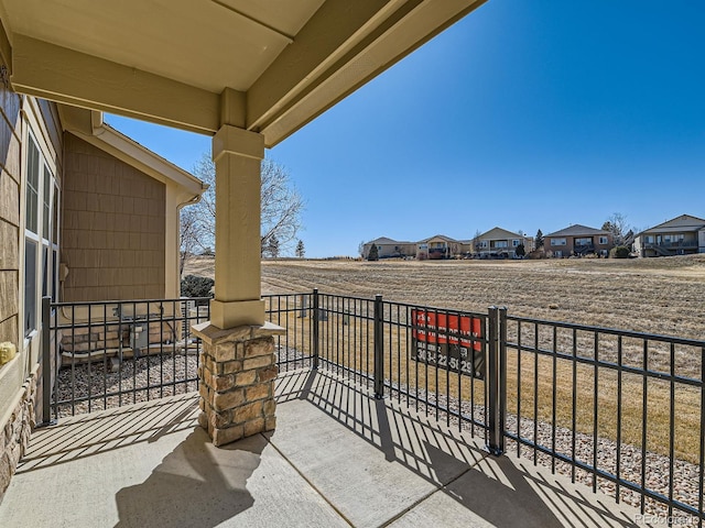 view of patio / terrace featuring a residential view and a balcony