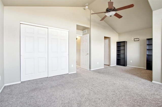 unfurnished bedroom with visible vents, ceiling fan, baseboards, carpet, and high vaulted ceiling