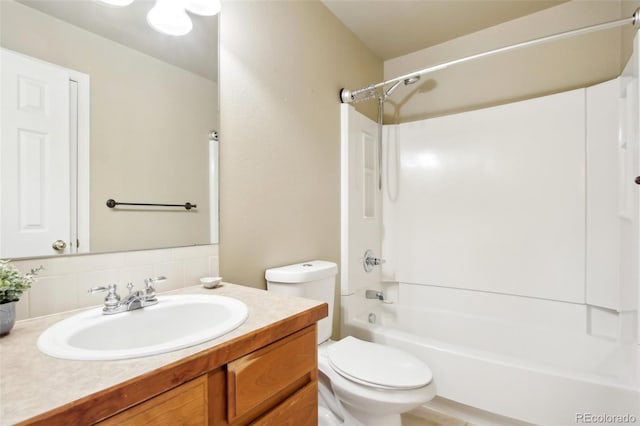 bathroom with decorative backsplash, vanity, toilet, and shower / bathtub combination