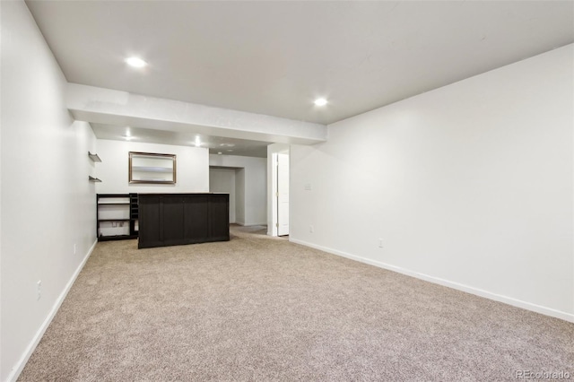 interior space featuring recessed lighting, light colored carpet, and baseboards