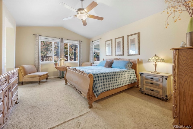 carpeted bedroom featuring ceiling fan and lofted ceiling