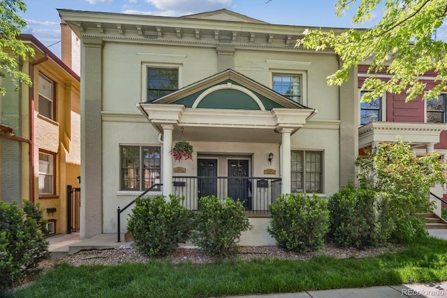 1580 N Franklin St, Denver, CO 80218 - view of front of property featuring covered porch and stucco siding