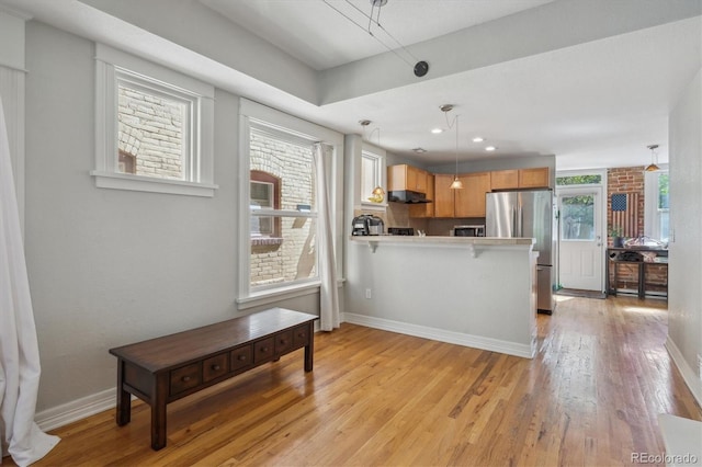 1580 N Franklin St, Denver, CO 80218 - kitchen featuring freestanding refrigerator, a peninsula, light wood-type flooring, baseboards, and recessed lighting