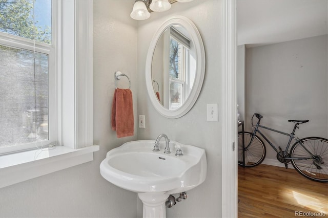 1580 N Franklin St, Denver, CO 80218 - bathroom featuring plenty of natural light, wood finished floors, a chandelier, and baseboards