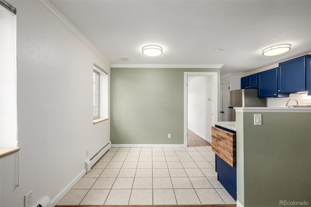 kitchen featuring crown molding, blue cabinets, a baseboard radiator, and light countertops