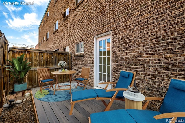 wooden deck featuring fence