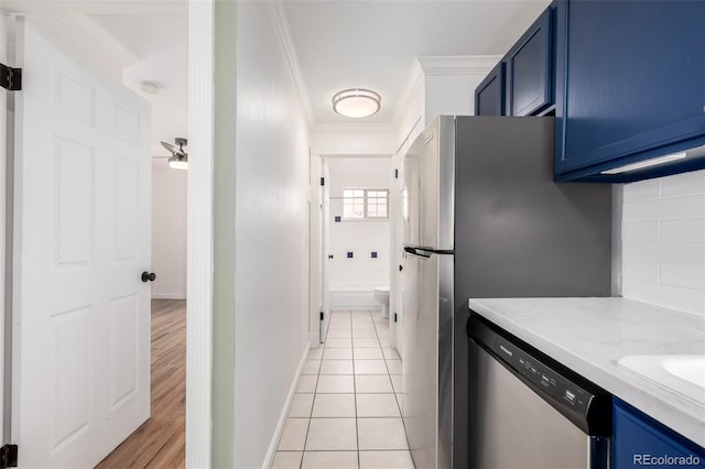 kitchen featuring stainless steel dishwasher, crown molding, light stone counters, backsplash, and blue cabinetry