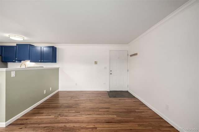 70 N Grant St Unit 10, Denver, CO 80203 - unfurnished room with crown molding, dark wood-type flooring, and baseboards