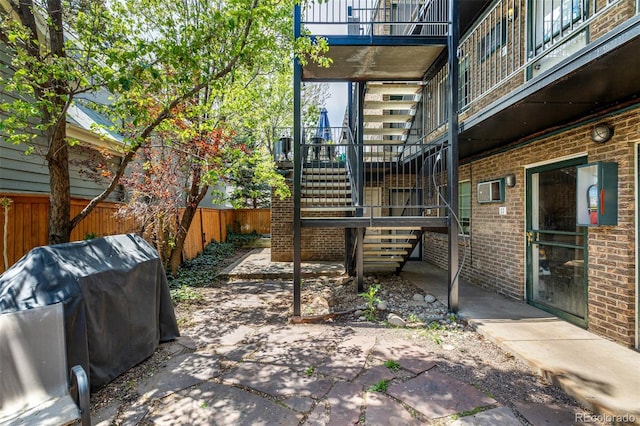 70 N Grant St Unit 10, Denver, CO 80203 - fenced backyard with stairs, a patio, and grilling area