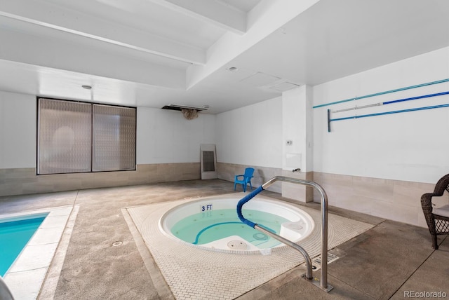 view of pool with an indoor in ground hot tub