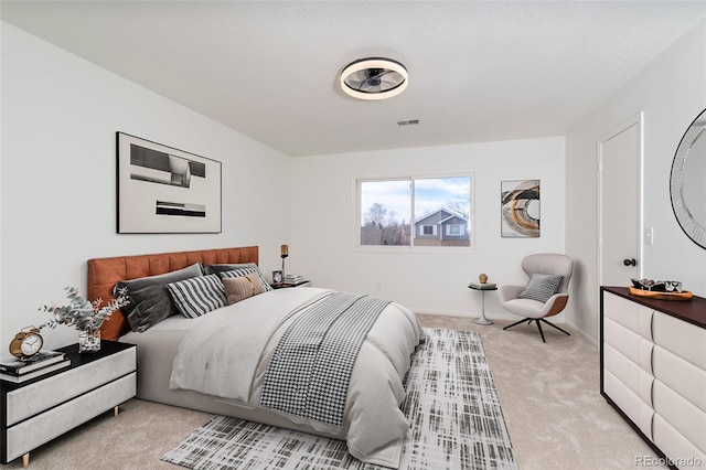 bedroom featuring light colored carpet