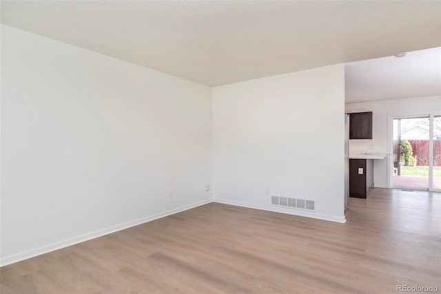 empty room featuring wood-type flooring