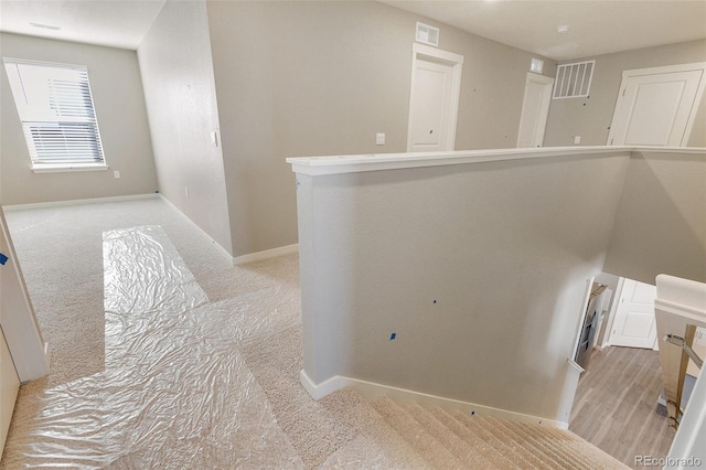18358 Field Mint Pt, Parker, CO 80134 - hallway with baseboards, light carpet, and visible vents