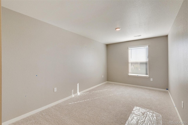 18358 Field Mint Pt, Parker, CO 80134 - unfurnished room with light colored carpet, baseboards, and visible vents