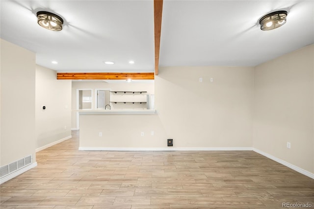1264 Uinta St, Denver, CO 80220 - unfurnished living room with baseboards, light wood-type flooring, recessed lighting, and beam ceiling