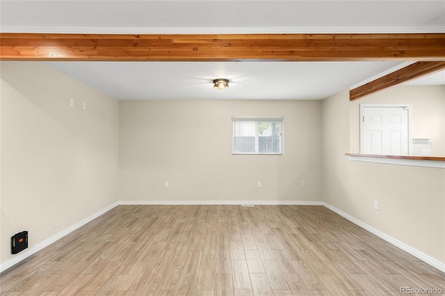 1264 Uinta St, Denver, CO 80220 - spare room with light wood-style floors, baseboards, and beam ceiling