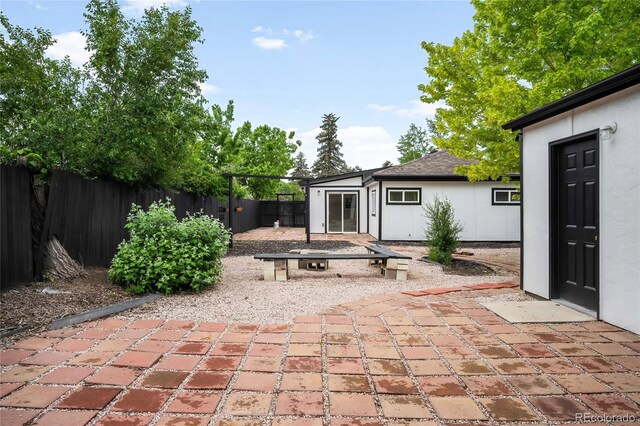 1264 Uinta St, Denver, CO 80220 - fenced backyard featuring a patio area and an outdoor structure