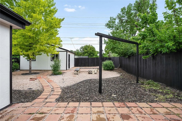 1264 Uinta St, Denver, CO 80220 - fenced backyard with an outbuilding and a patio