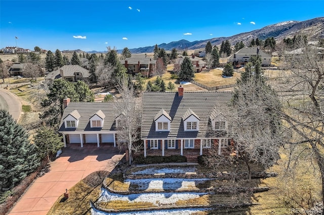 birds eye view of property featuring a mountain view