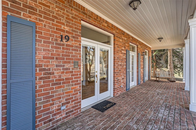 view of patio featuring covered porch and french doors