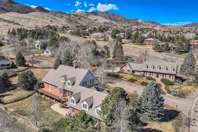 drone / aerial view featuring a mountain view