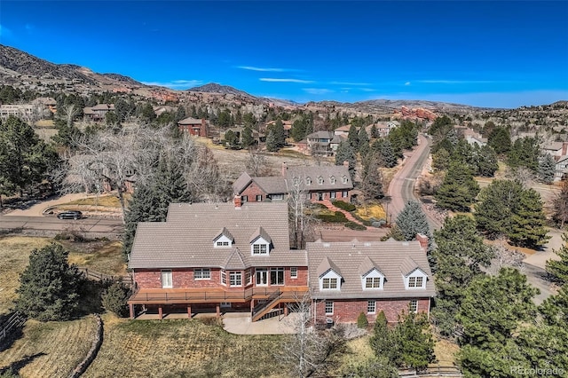 birds eye view of property with a mountain view