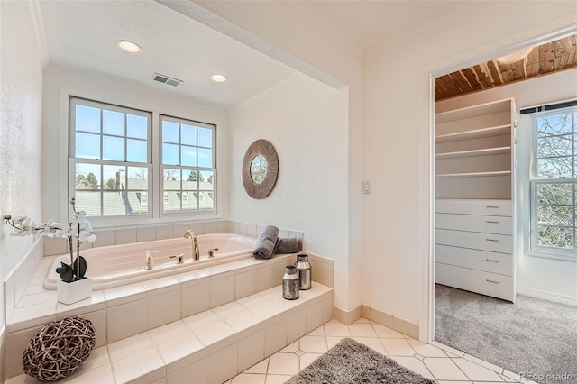 full bathroom with a garden tub, recessed lighting, crown molding, and baseboards