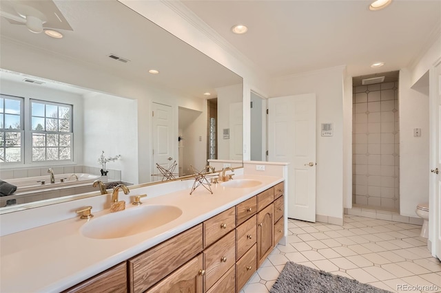 full bath featuring a sink, visible vents, double vanity, and recessed lighting