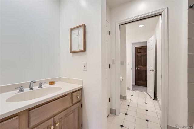 bathroom featuring vanity and baseboards