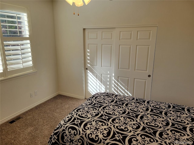 bedroom with carpet floors and a closet