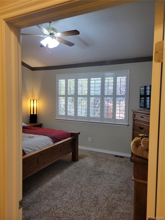 carpeted bedroom featuring ceiling fan and vaulted ceiling