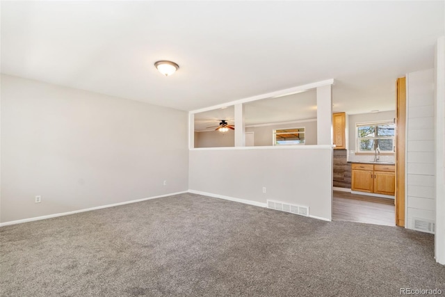 3270 W 92nd Pl, Westminster, CO 80031 - unfurnished room featuring carpet flooring, a ceiling fan, baseboards, and a sink