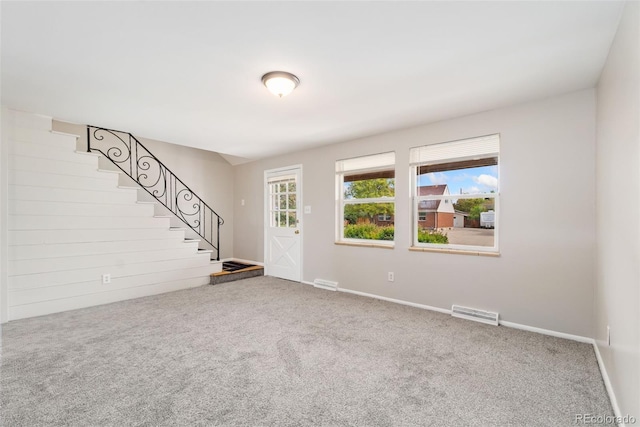 3270 W 92nd Pl, Westminster, CO 80031 - unfurnished living room with stairway, carpet, and baseboards