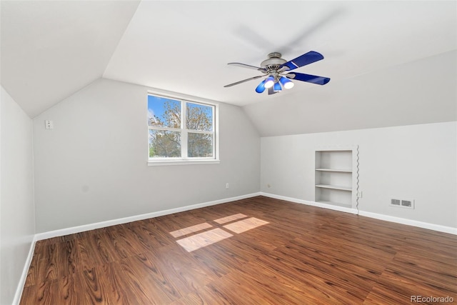 3270 W 92nd Pl, Westminster, CO 80031 - bonus room with built in shelves, vaulted ceiling, baseboards, wood finished floors, and ceiling fan