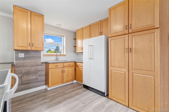 3270 W 92nd Pl, Westminster, CO 80031 - kitchen with freestanding refrigerator, a sink, light brown cabinetry, light wood-type flooring, and tasteful backsplash