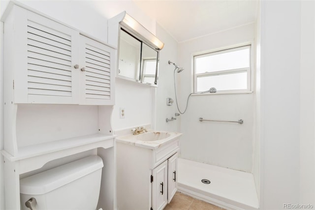 3270 W 92nd Pl, Westminster, CO 80031 - full bathroom featuring a shower, toilet, vanity, and tile patterned floors
