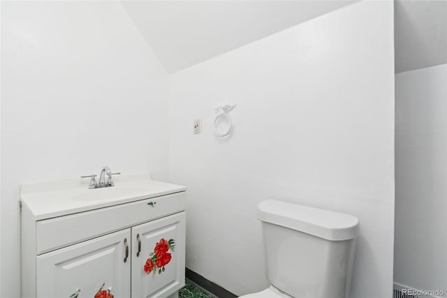 3270 W 92nd Pl, Westminster, CO 80031 - half bathroom featuring toilet, vanity, and lofted ceiling