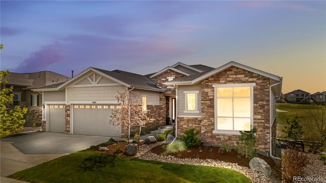 8691 S Sicily Ct, Aurora, CO 80016 - view of front facade featuring stone siding, an attached garage, concrete driveway, and a front yard
