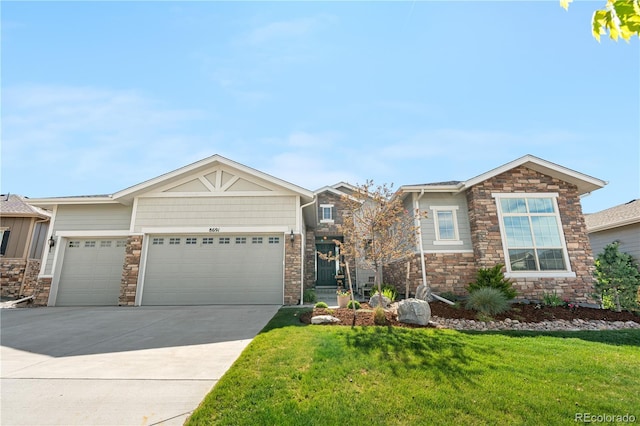 8691 S Sicily Ct, Aurora, CO 80016 - view of front facade with a garage, a front lawn, stone siding, and driveway