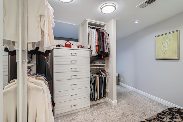 spacious closet featuring light carpet and visible vents