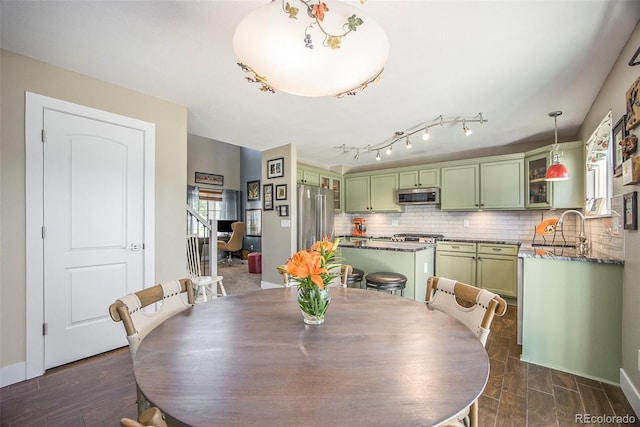 9200 W Indore Dr, Littleton, CO 80128 - dining room with baseboards and dark wood finished floors