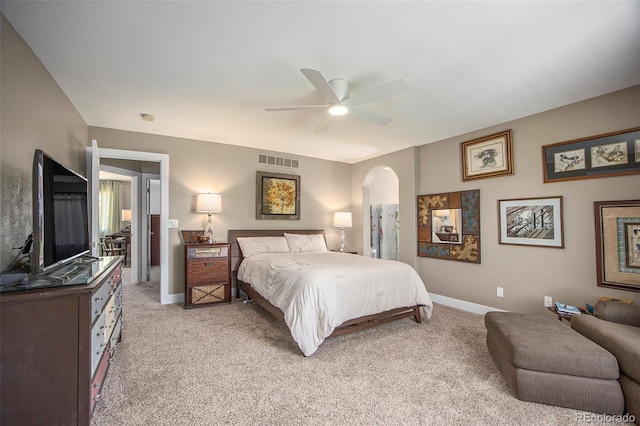 9200 W Indore Dr, Littleton, CO 80128 - bedroom with arched walkways, light colored carpet, and a ceiling fan
