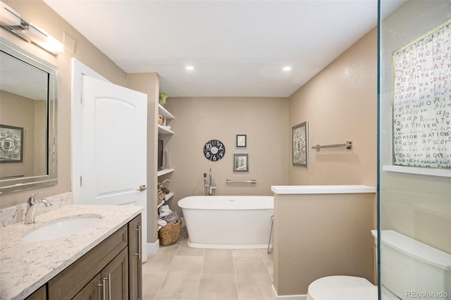 9200 W Indore Dr, Littleton, CO 80128 - bathroom with vanity, a freestanding tub, and recessed lighting