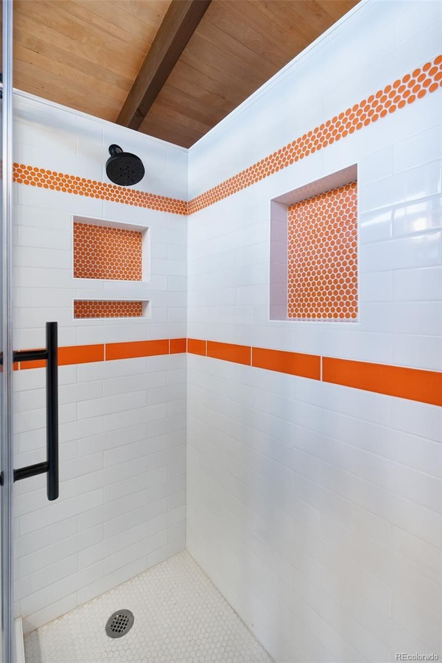 bathroom featuring beam ceiling, wood ceiling, and walk in shower