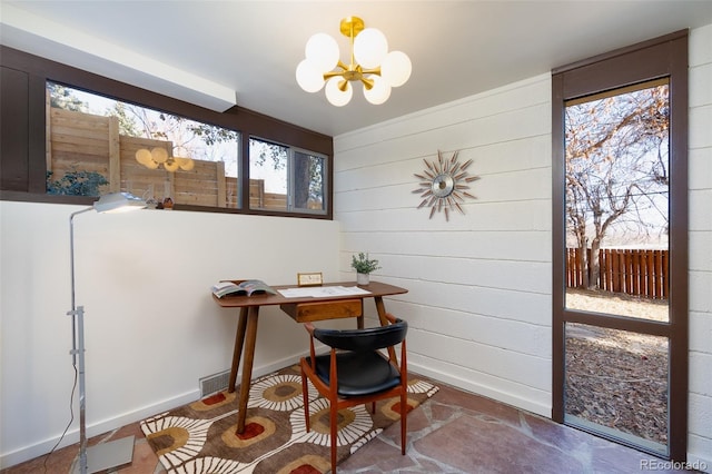 office featuring an inviting chandelier