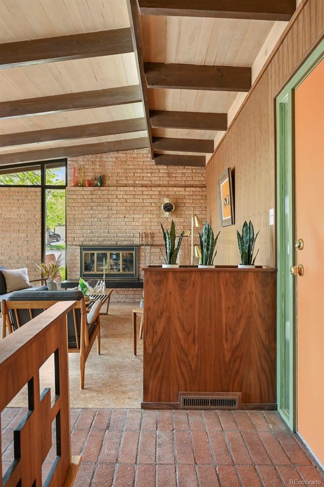 5450 Mohawk Rd, Littleton, CO 80123 - reception area with beam ceiling, a fireplace, and wood ceiling